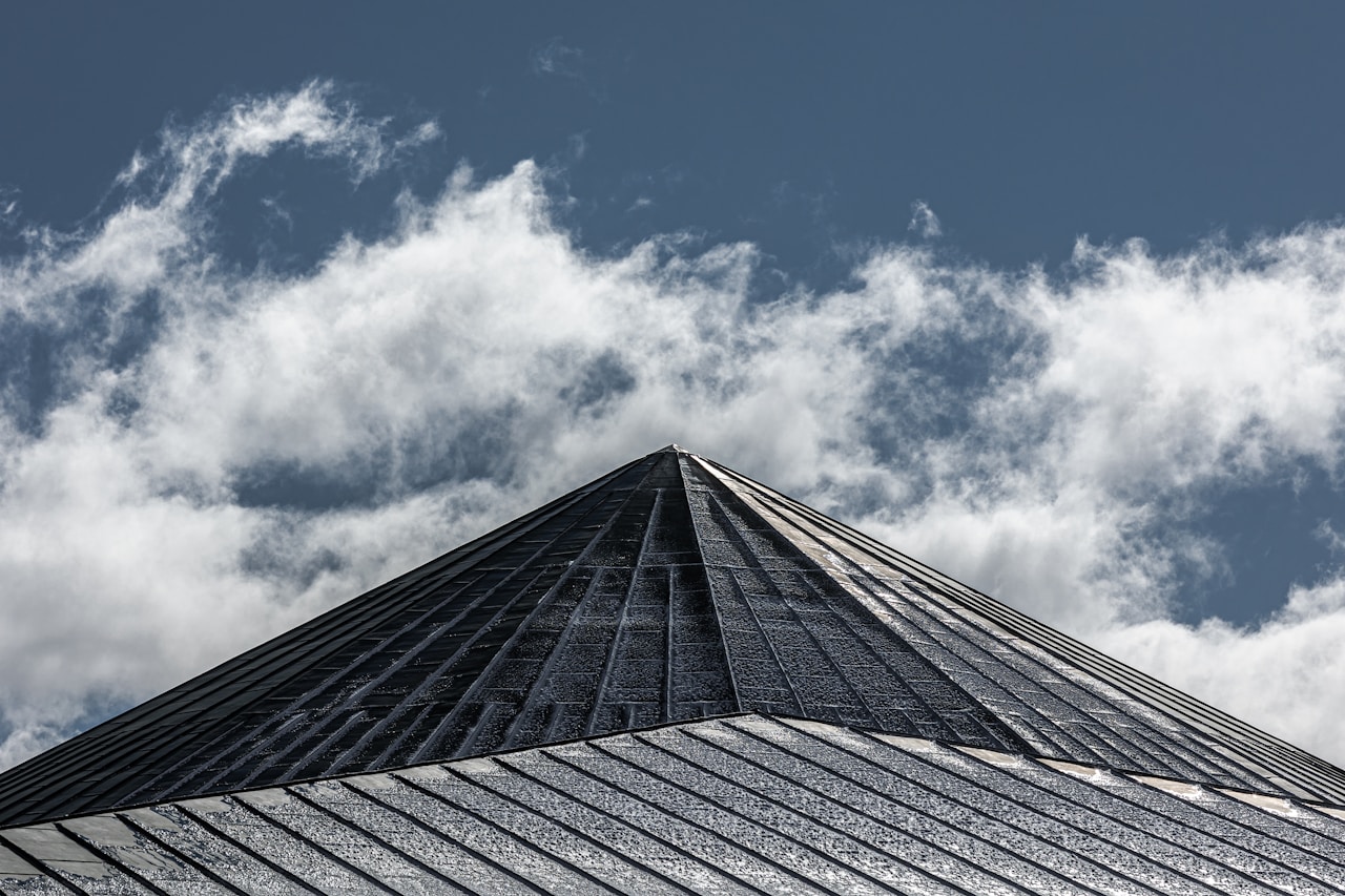 a very tall building with a sky background